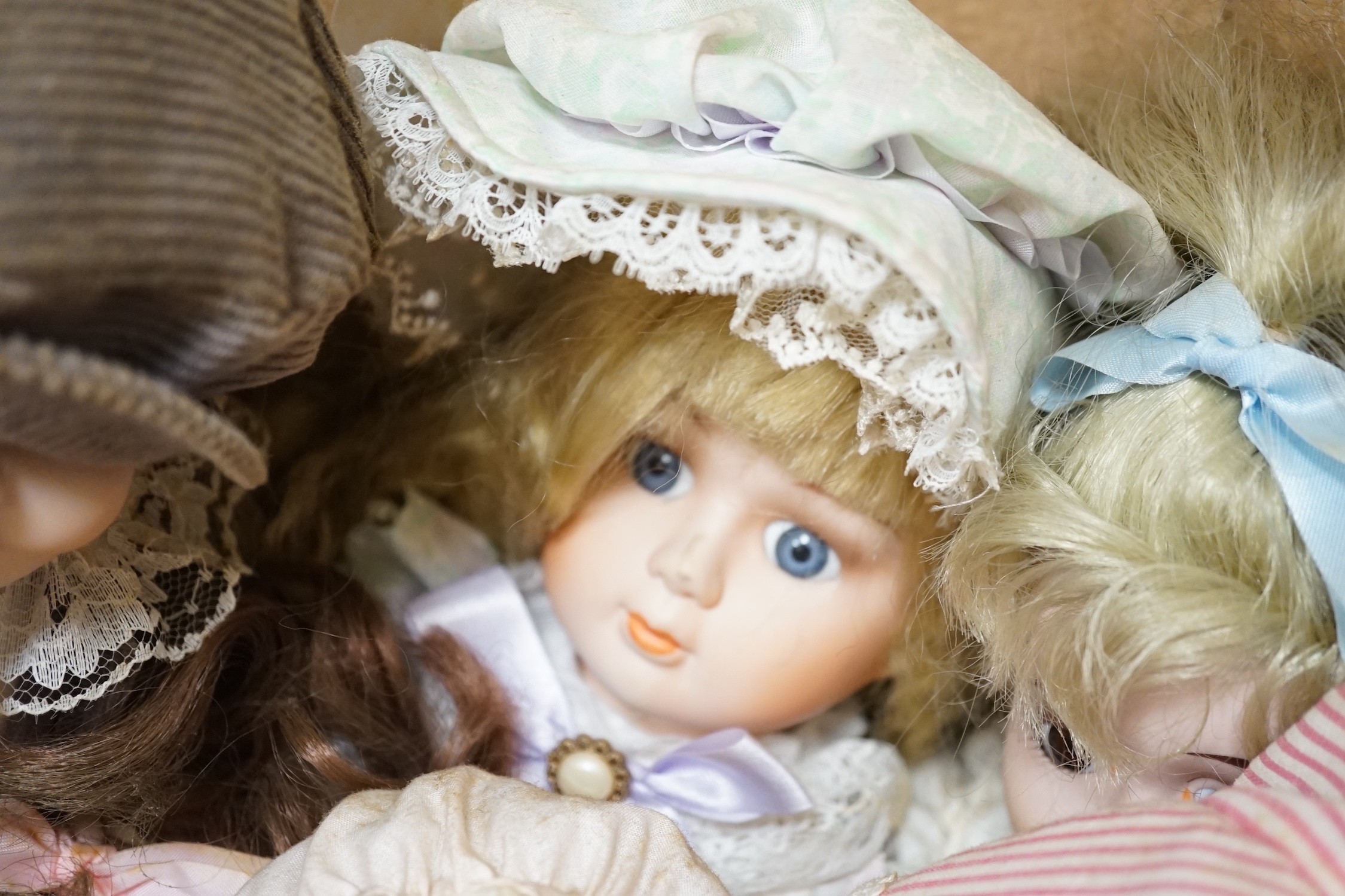A quantity of various dolls